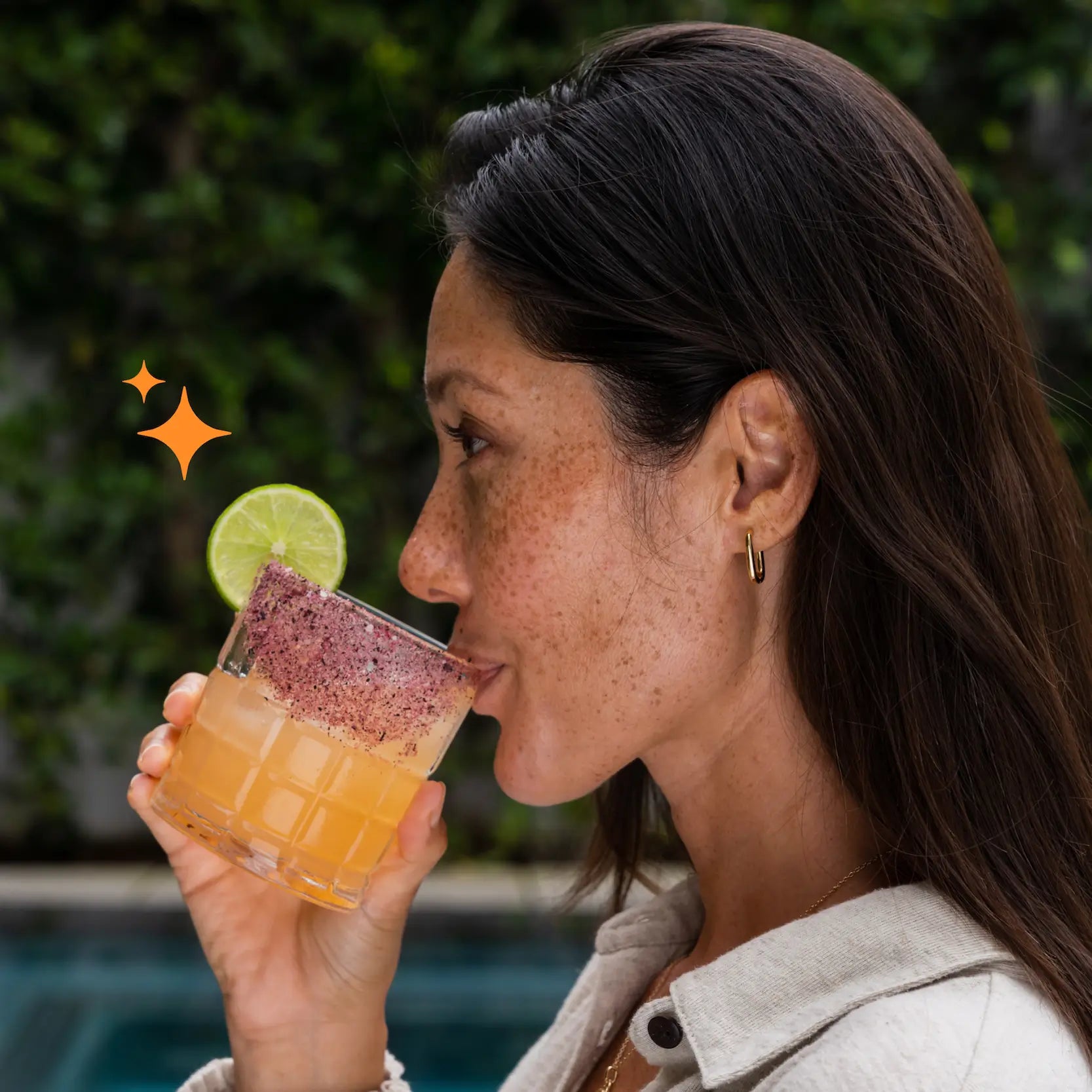 female drinking a spicy margarita